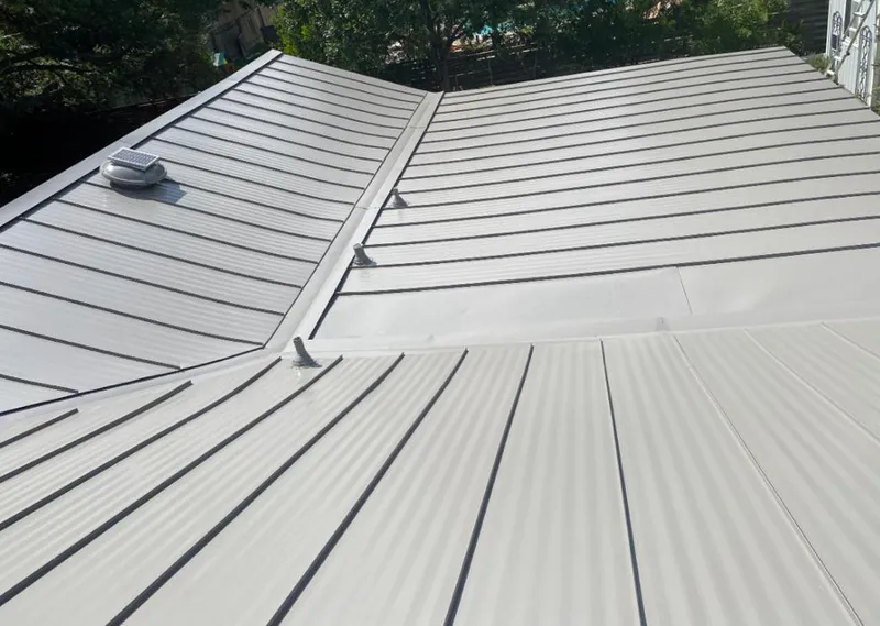 Solar attic fan installed on a metal roof for Roof Ventilation in Sun Valley